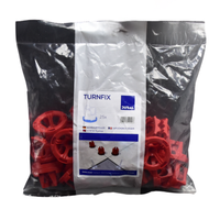 Durchsichtige Plastikverpackung der DURAL Turnfix Zughauben mit Etikett. In der Verpackung befinden sich rote Zughauben