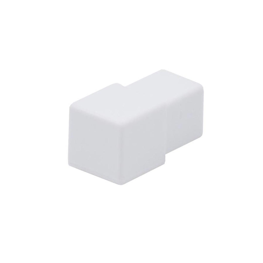 Detailaufnahme eines würfelförmigen DURAL Eckstücks Quadratprofil aus PVC in weiß #farbe_weiß