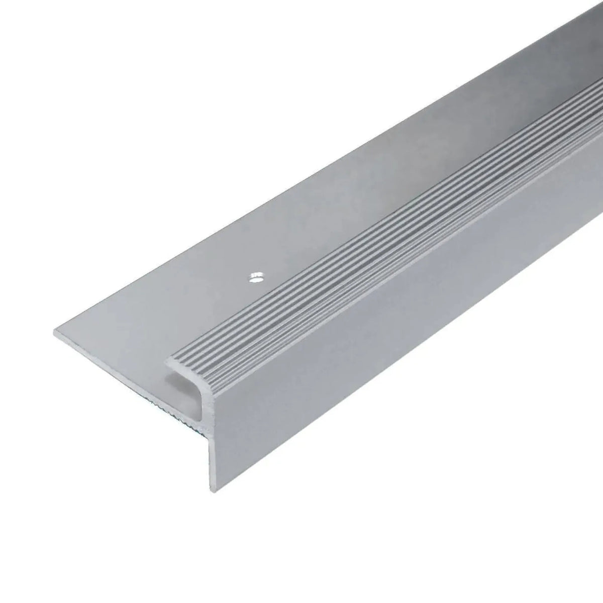 Detailed view of the silver anodised stair edge profile F-shape with grooved visible edge